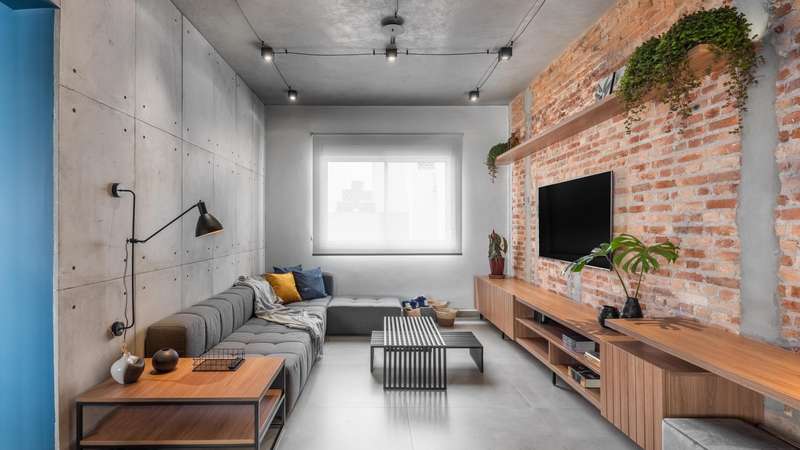 apartamento industrial pequeno com iluminação artificial
